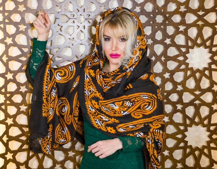 portrait-woman-wearing-scarf-standing-against-wall_1048944-17336219.webp