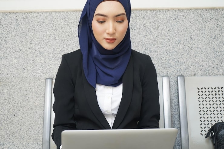 Businesswoman in hijab using laptop.jpg
