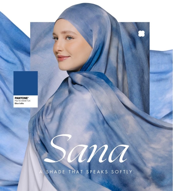a woman wearing a blue tie-dye hijab with pantone color swatch.jpg